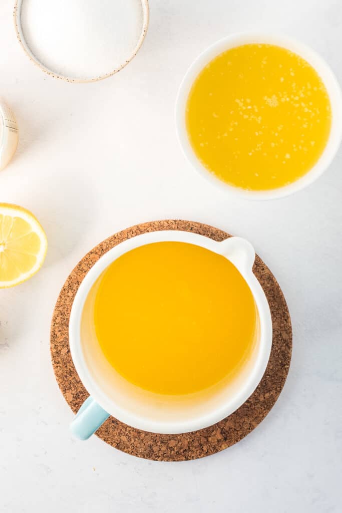 Melted butter in white container overhead image