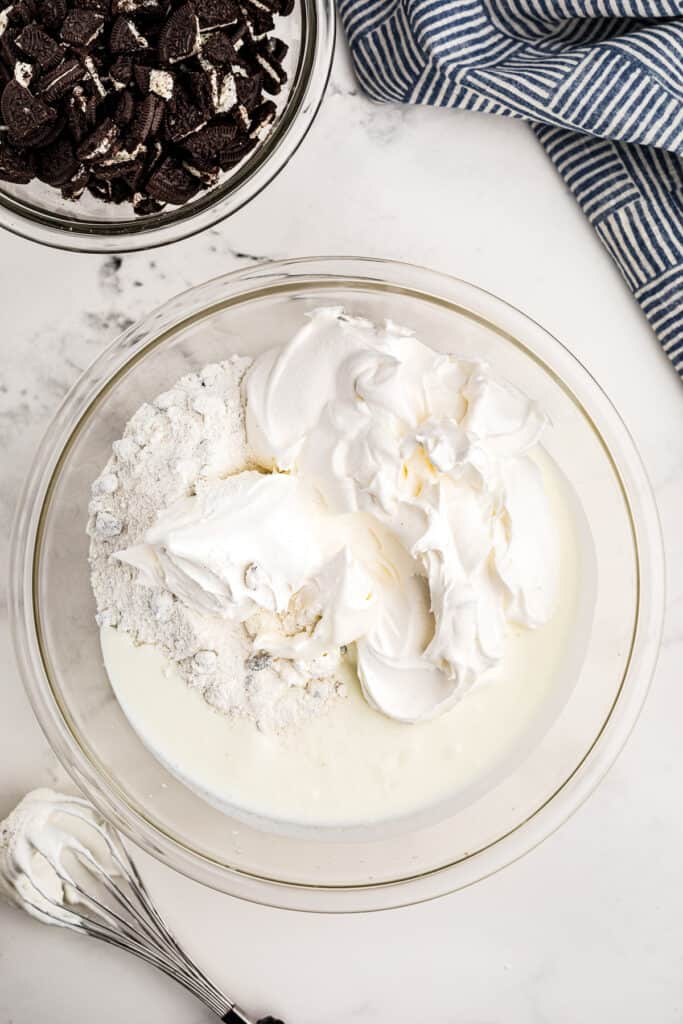 Overhead Image of glass bowl with milk and Cool Whip