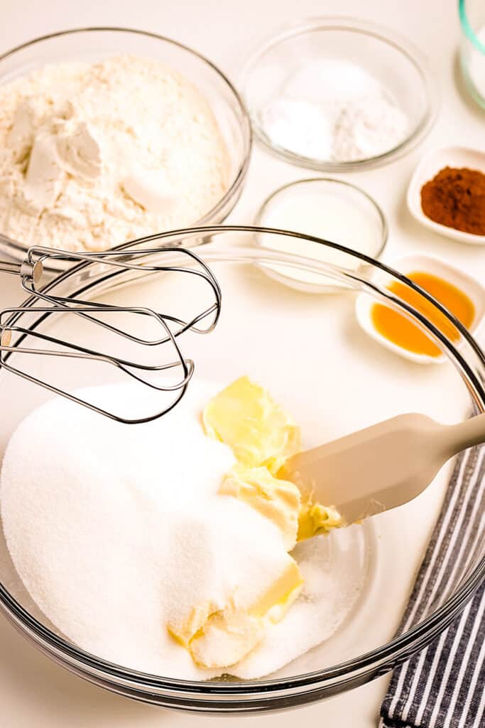 Glass bowl with sugar and butter before mixing