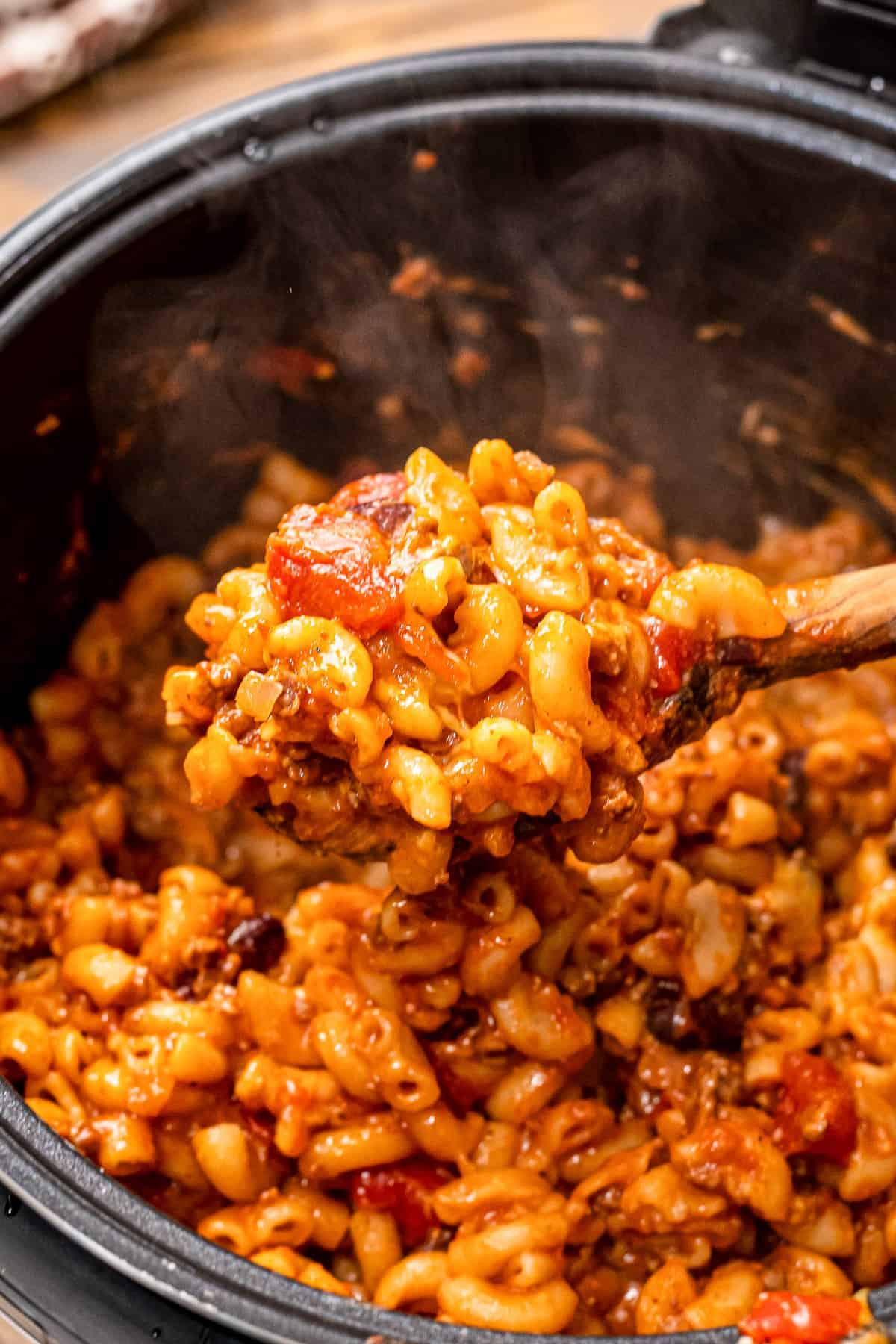Spoon of chili mac over an Instant Pot