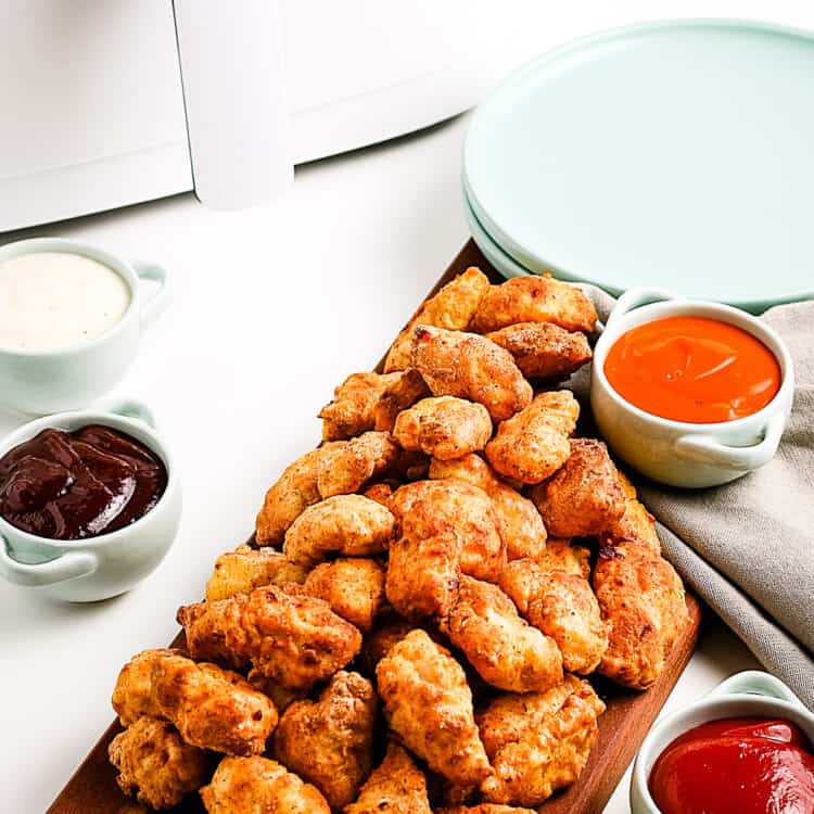 Popcorn chicken on a wood cutting board