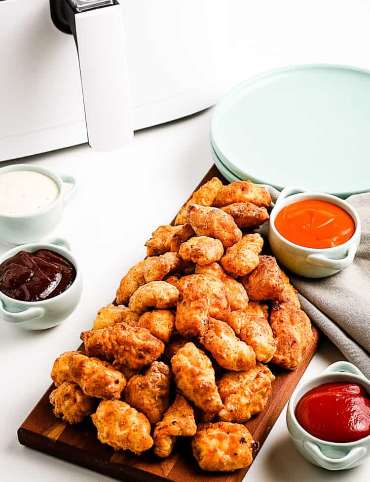 Popcorn chicken on a wood cutting board