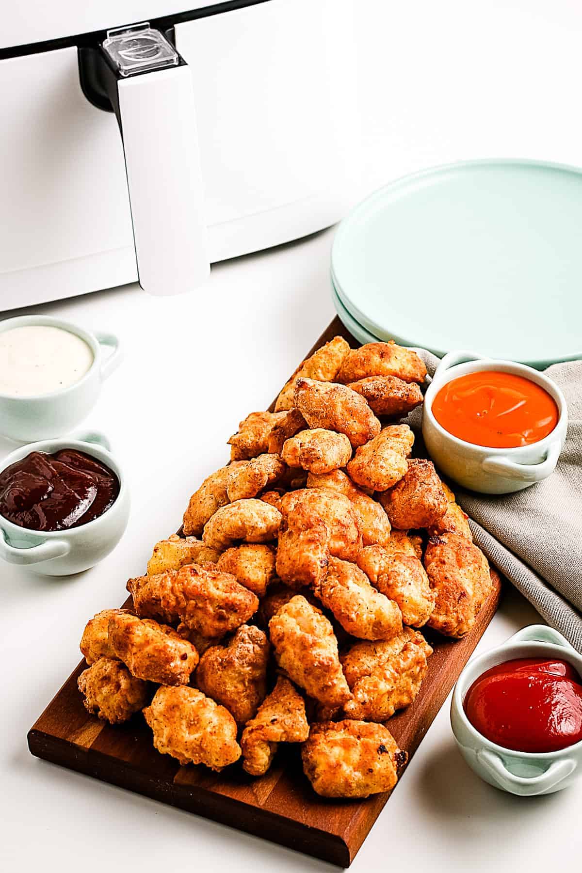 Popcorn chicken on a wood cutting board