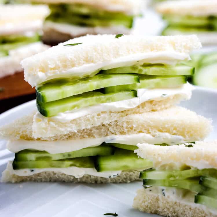 Close up image of stacked cucumber sandwiches