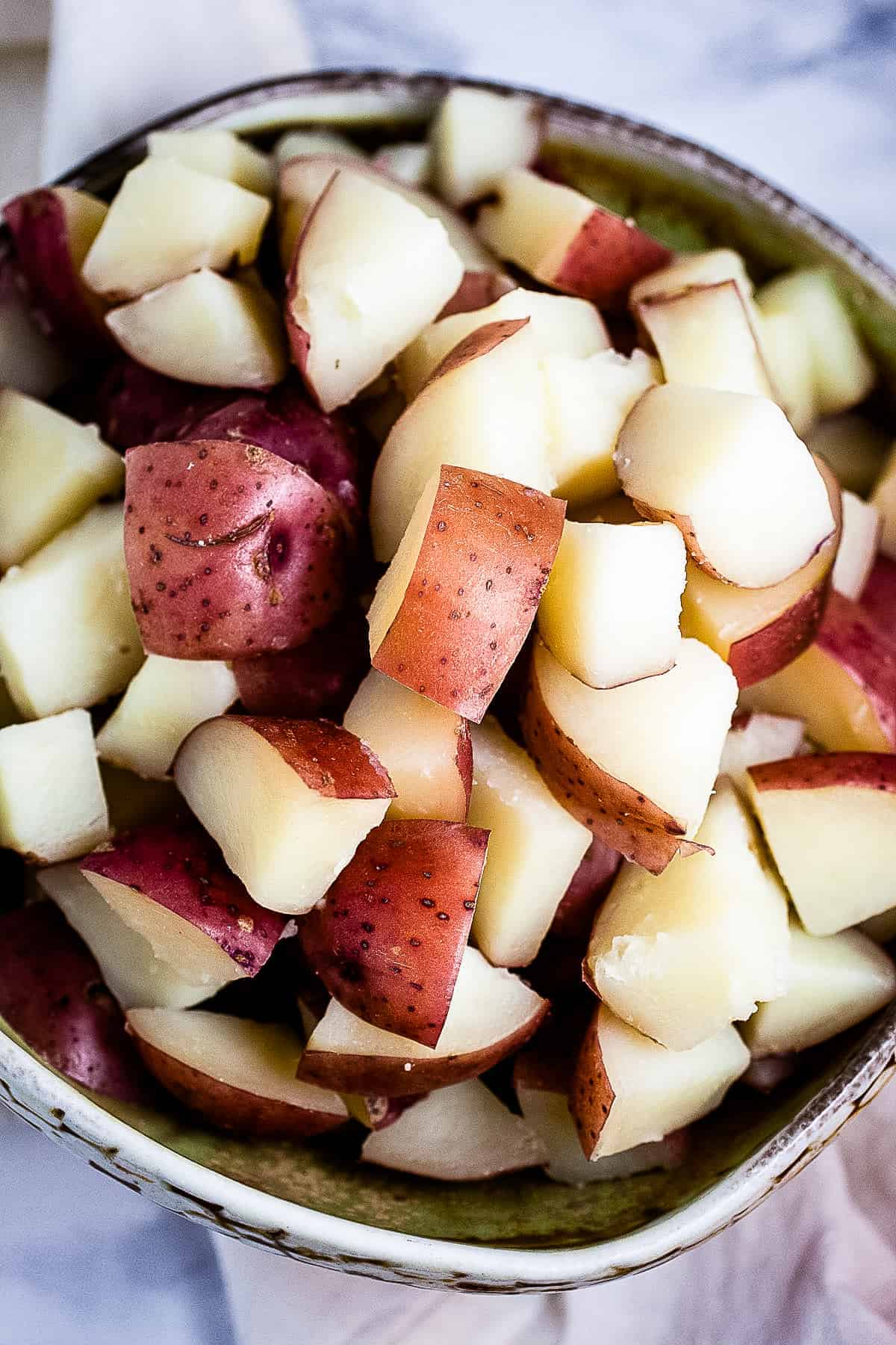 Chopped red potatoes in large bowl