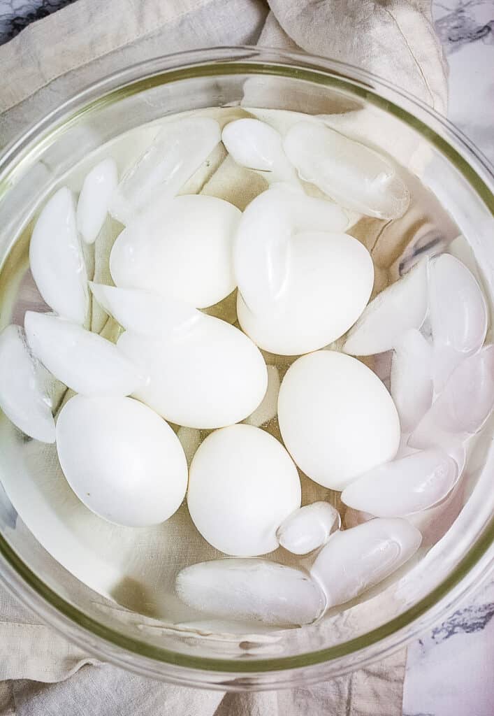 Hard boiled eggs in ice bath bowl