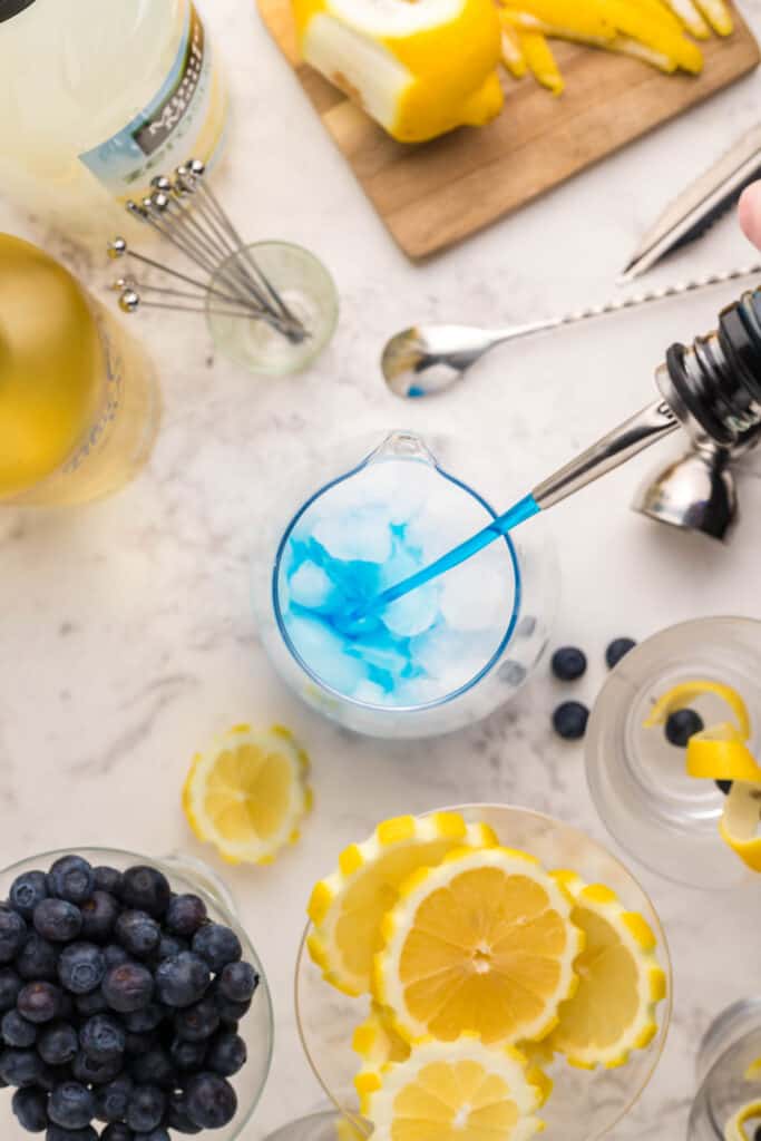 Pouring blue curacao into pitcher