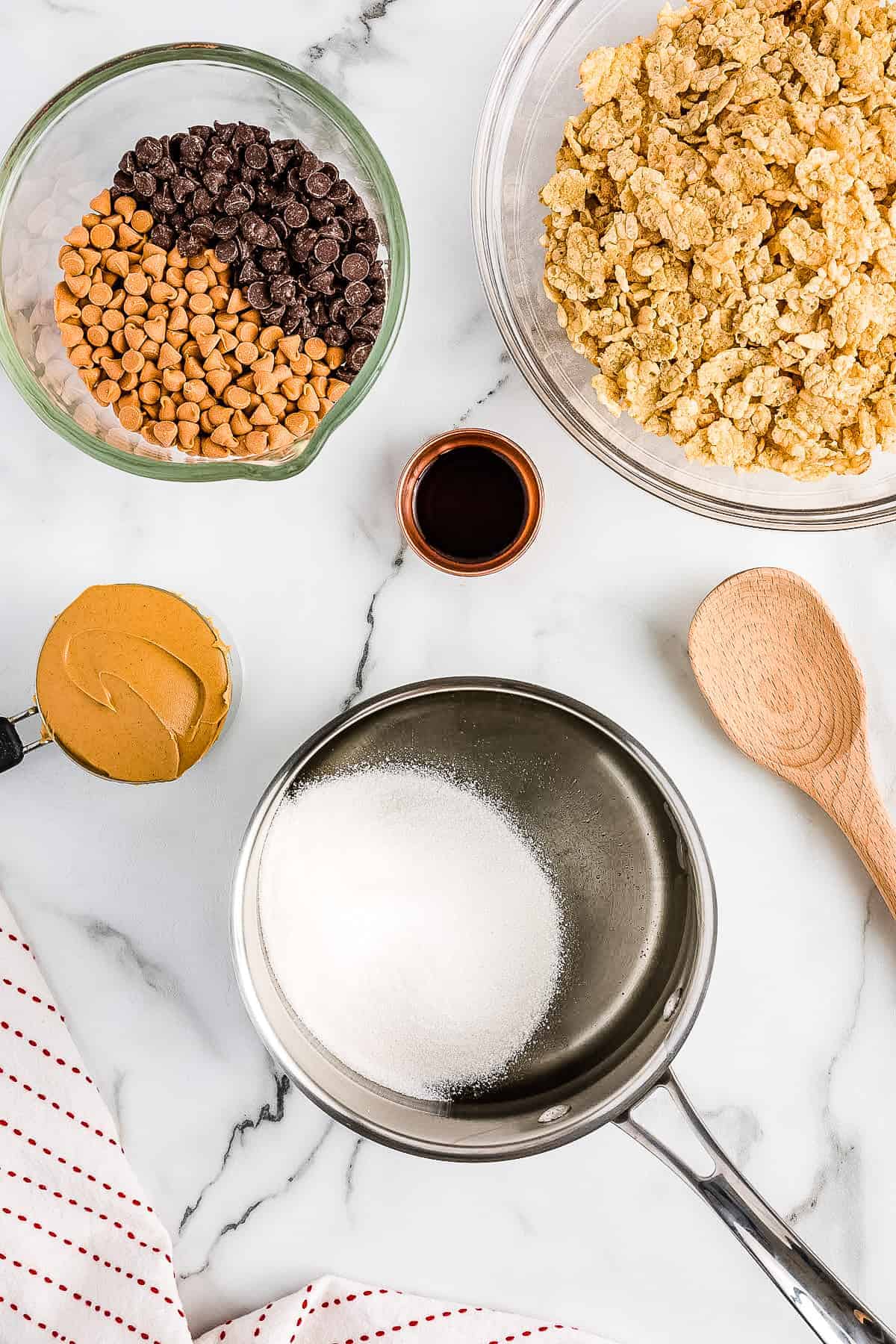 A saucepan with sugar and corn syrup before melting together