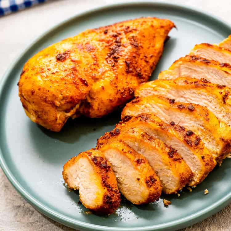 Air Fryer Chicken Breast sliced and plated on blue plate