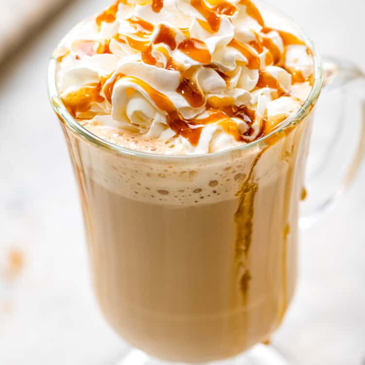 Caramel Latte in a glass with whipped topping and caramel sauce