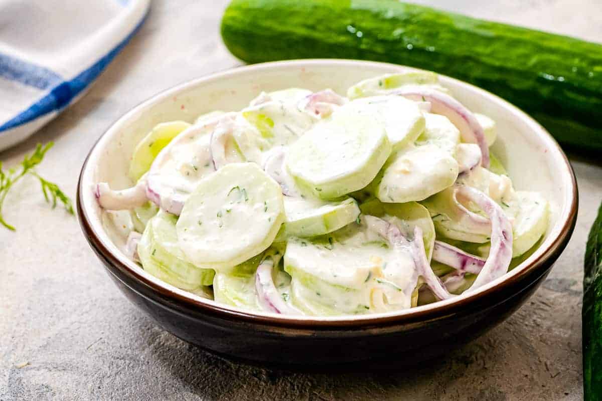 Bowl with creamy cucumber salad in it