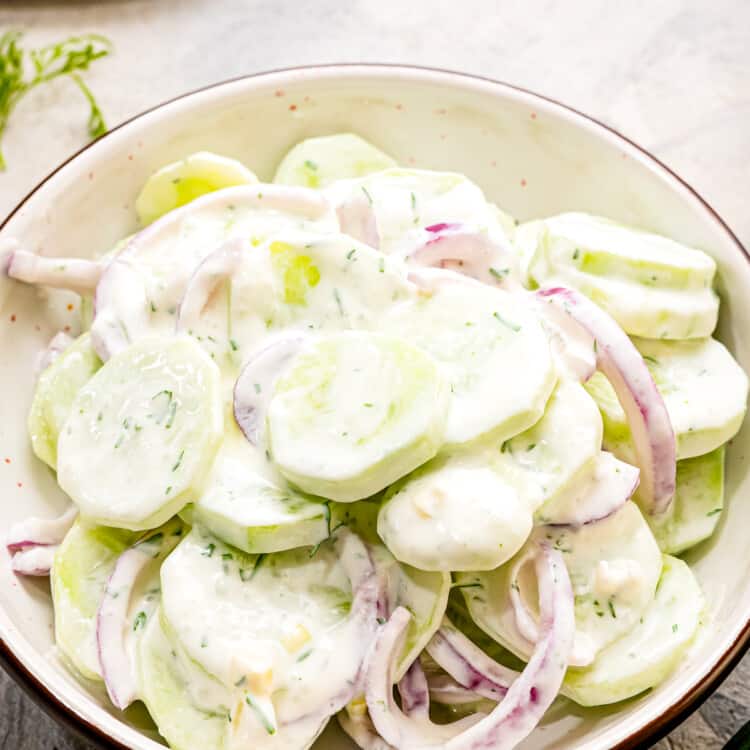 A bowl with homemade creamy cucumber salad