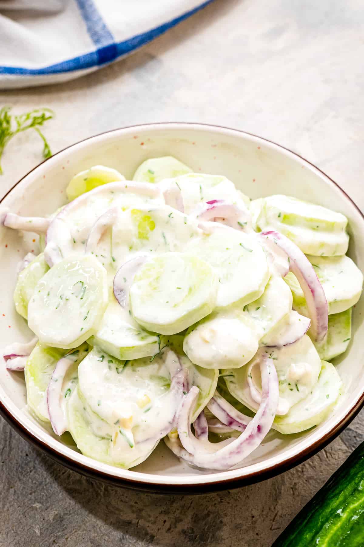 A bowl with homemade creamy cucumber salad