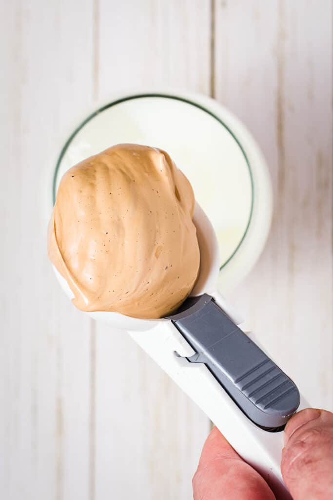 Whipped coffee in spoon