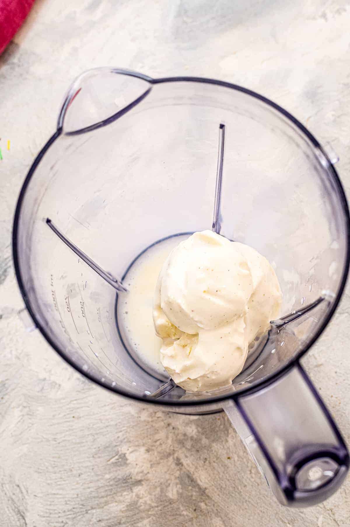 Blender with vanilla ice cream and milk