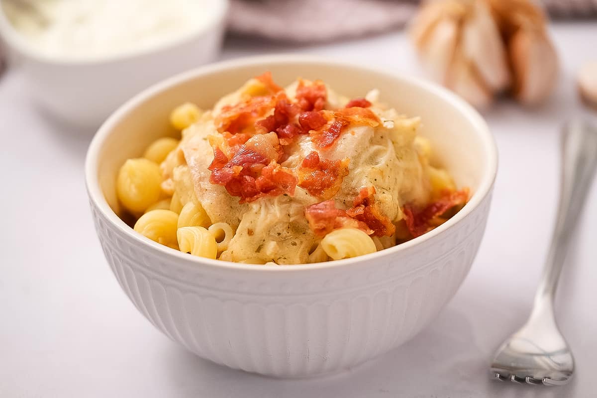 Pasta with chicken bacon ranch mixture in white bowl