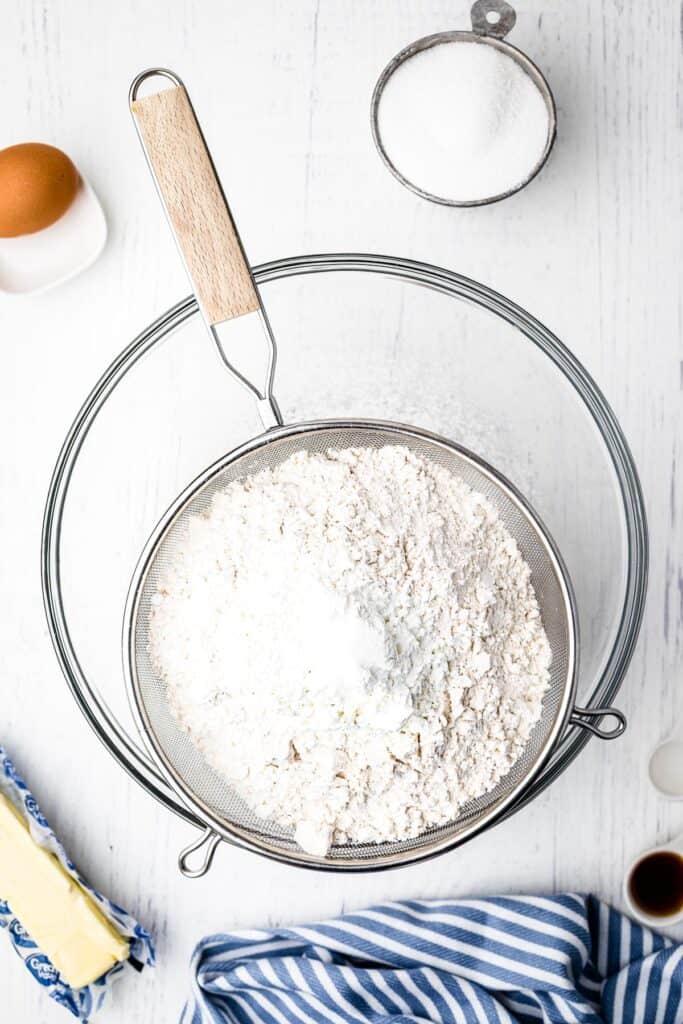 Sifting dry ingredients for sugar cookies