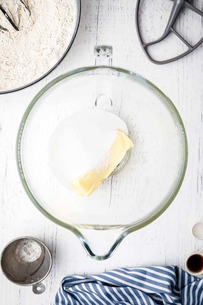 Sugar and butter in glass bowl for cookies