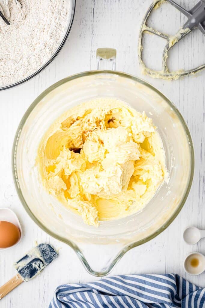 Glass bowl with mixed wet ingredients for sugar cookies