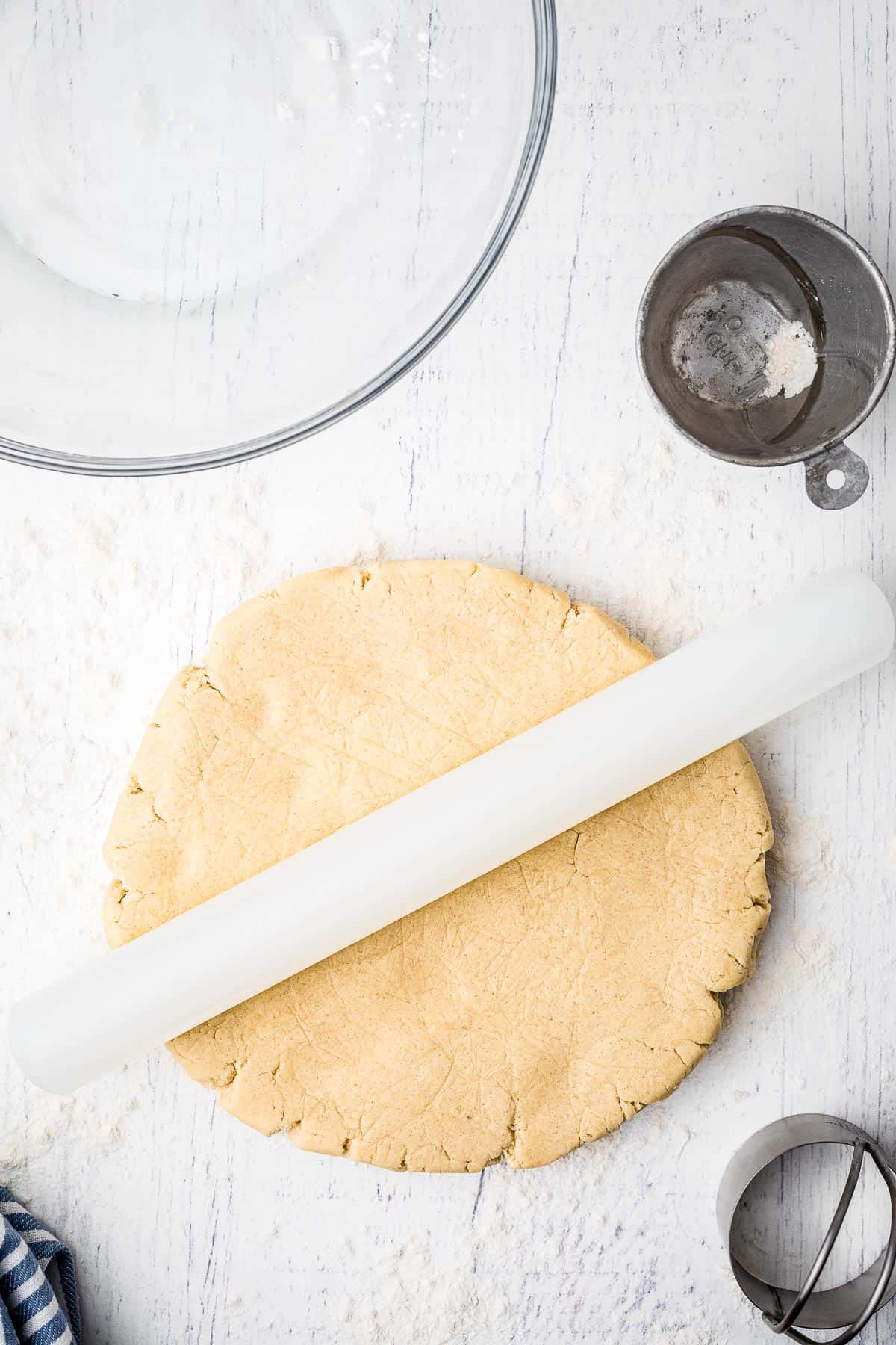Rolling sugar cookie dough out with rolling pin