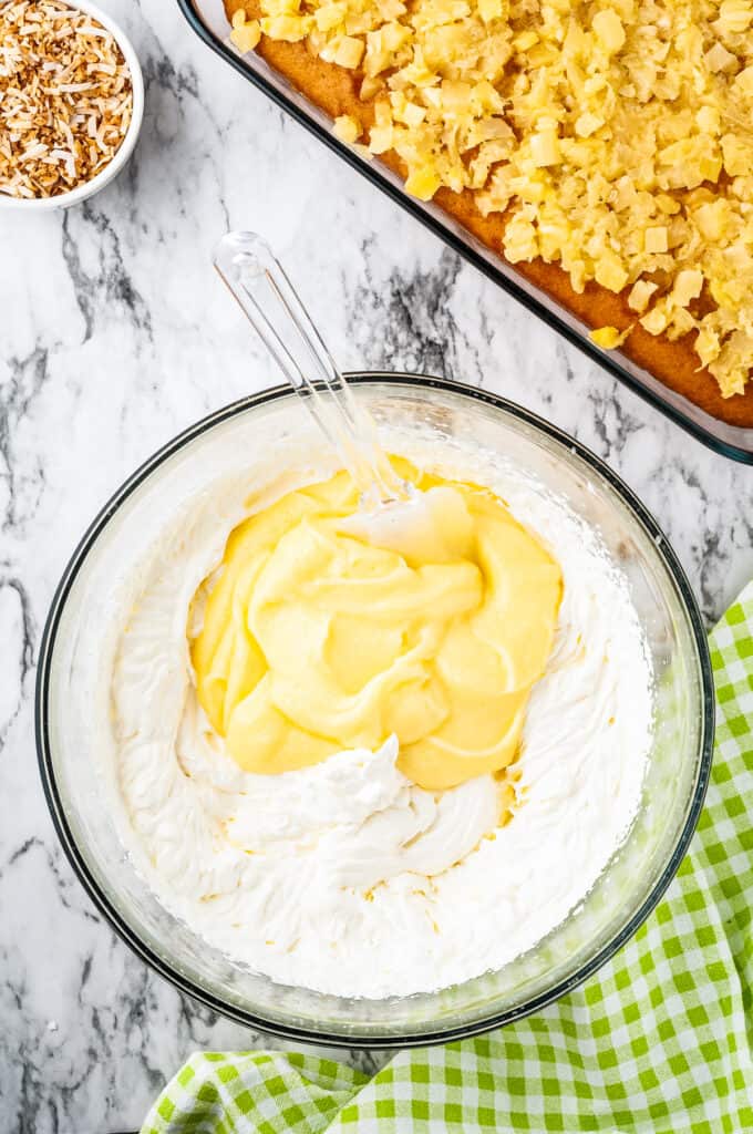 Glass bowl with whipped cream and pudding mix