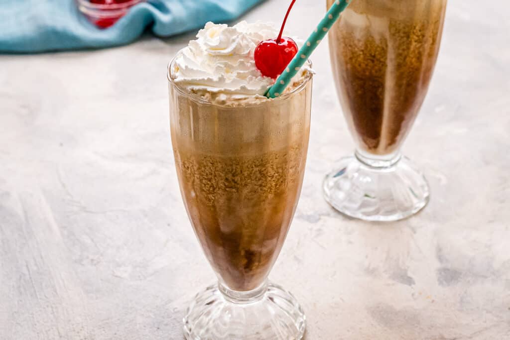Root beer floats with paper straw