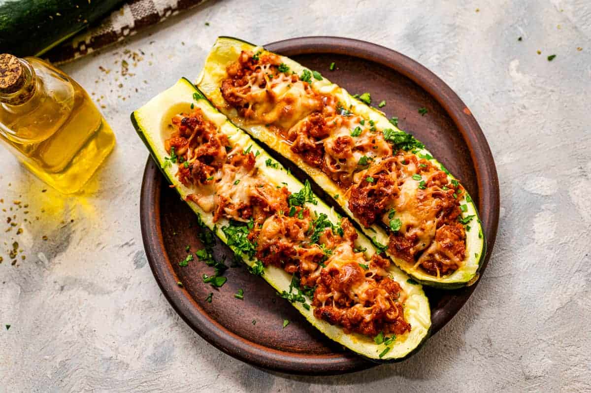 Stuffed Zucchini Boats on a wood plate