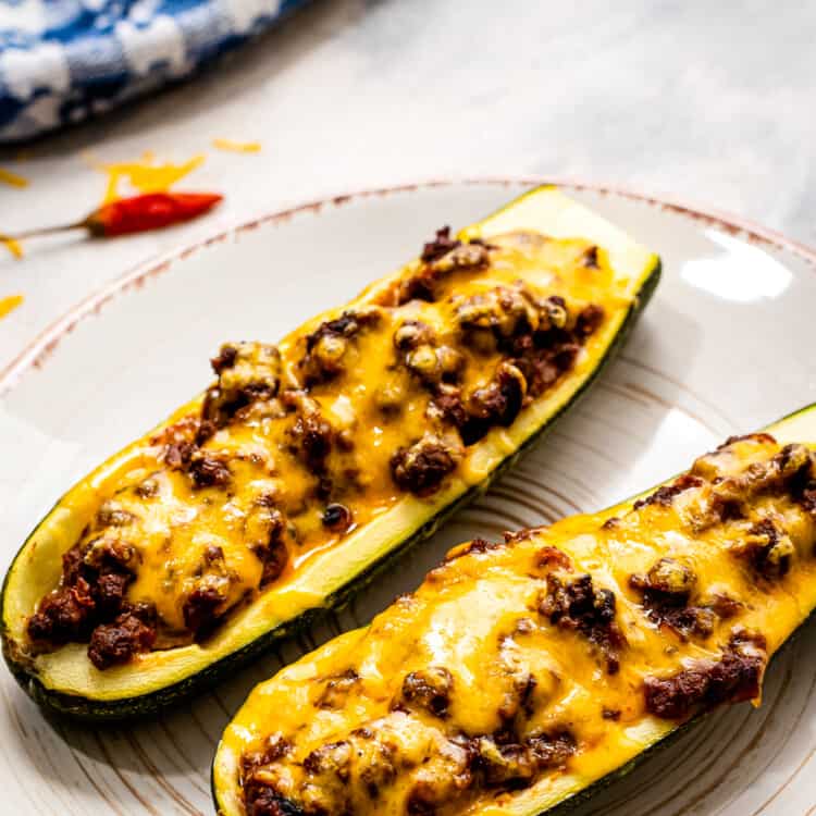 Plate with two taco stuffed zucchini boats