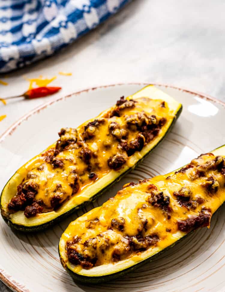 Plate with two taco stuffed zucchini boats