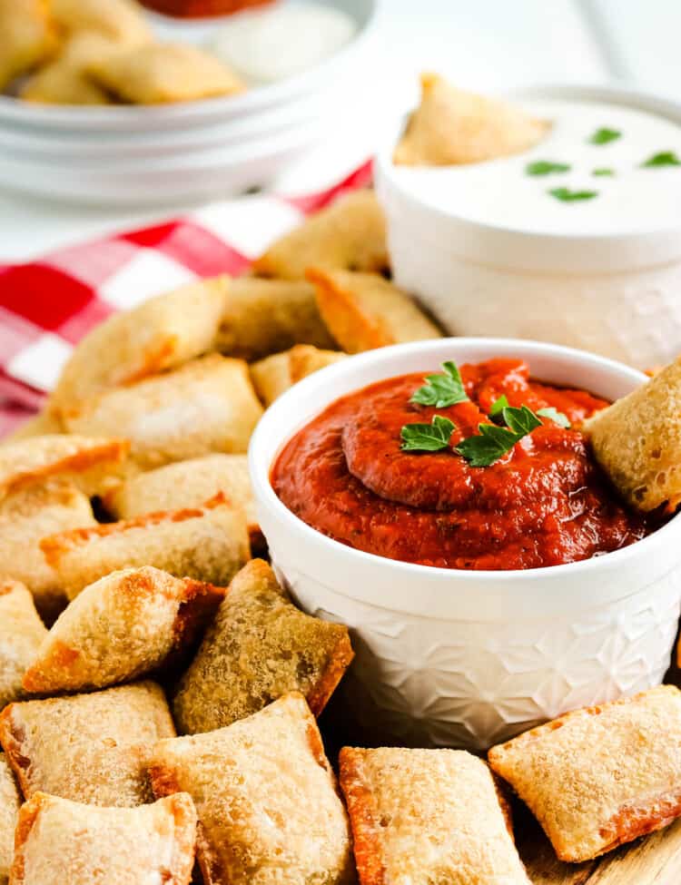 Air Fryer Pizza Rolls on cutting board with marinara