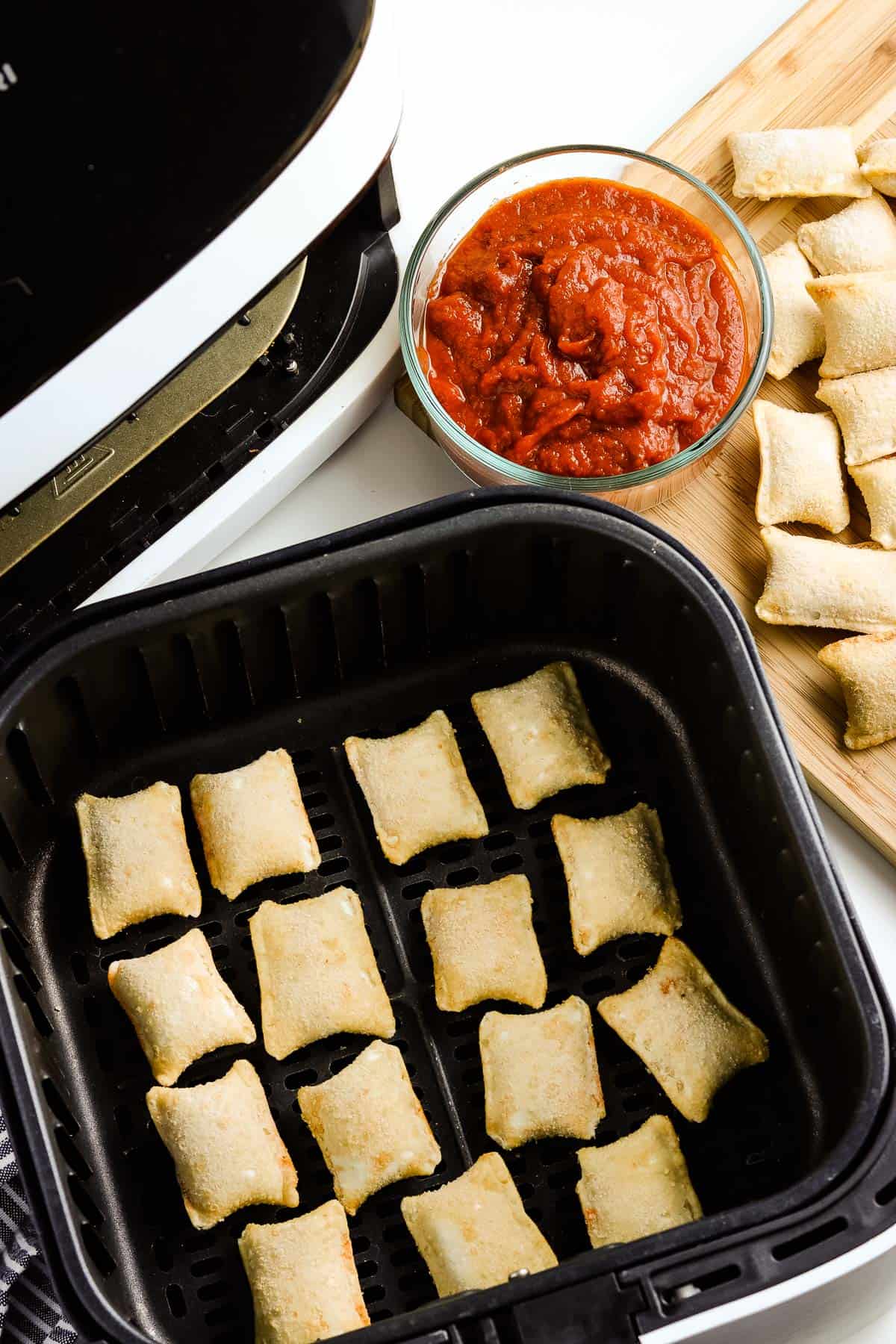 Frozen pizza rolls in air fryer basket