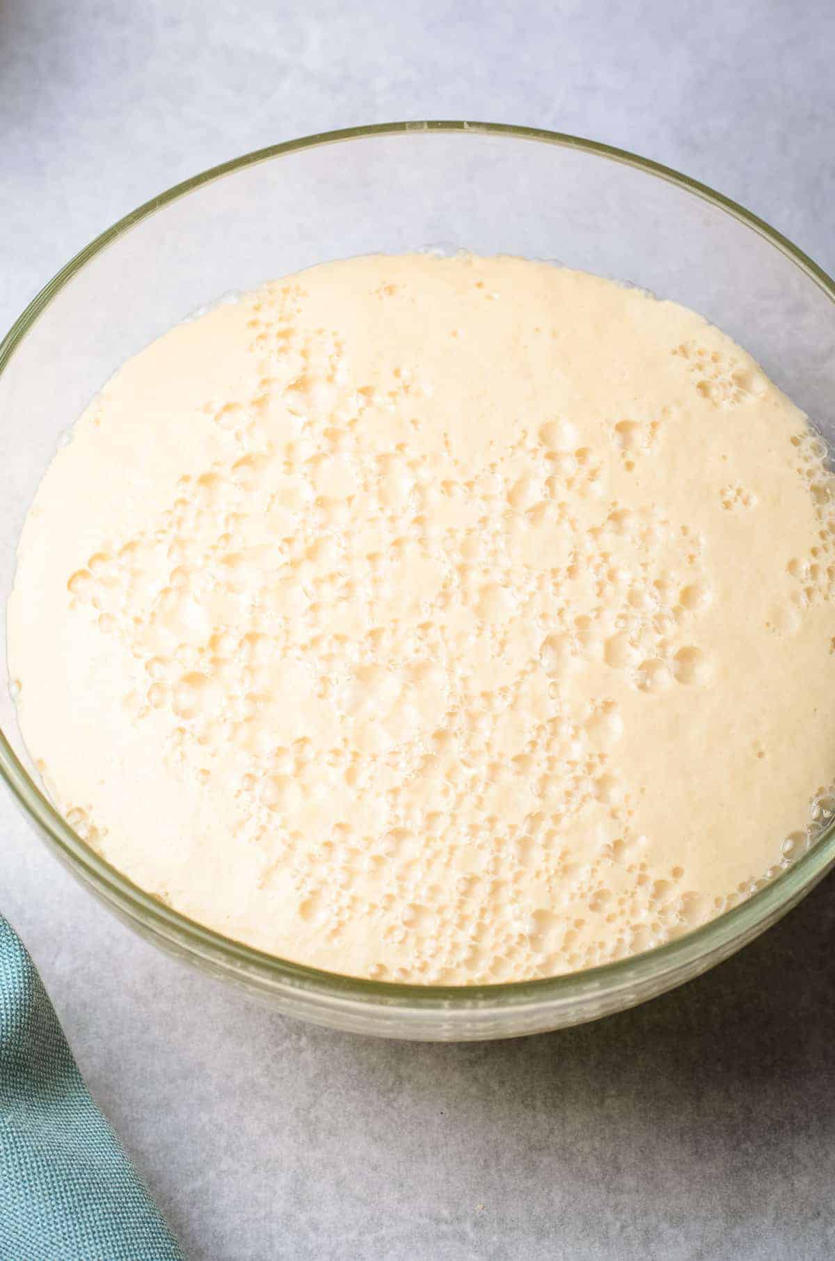 Yeast bubbling from being proofed in glass bowl