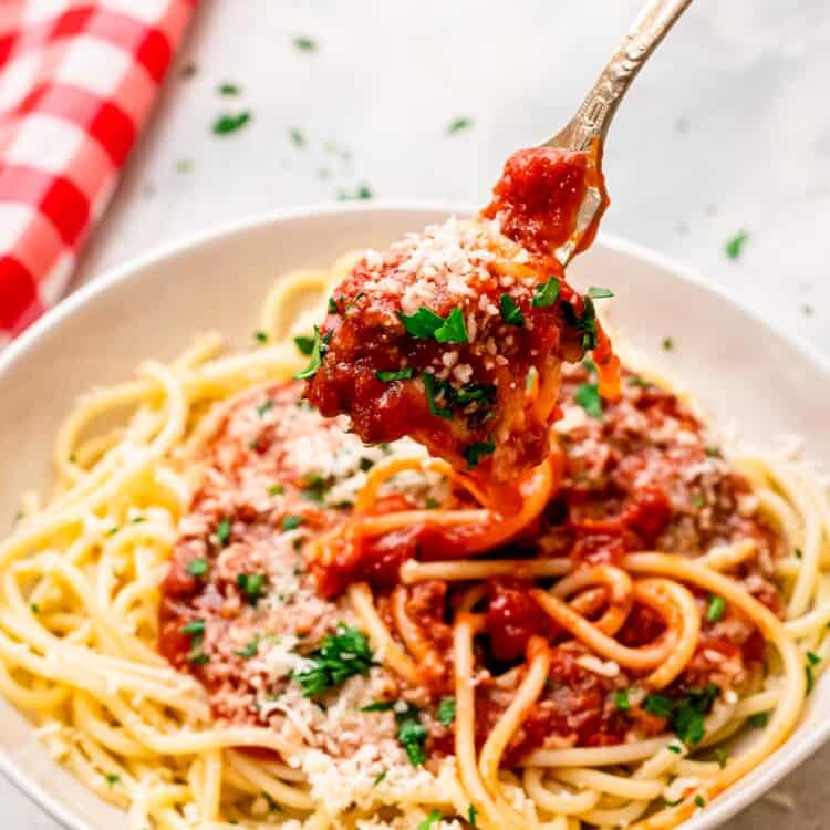 Fork twirling spaghetti noodles and sauce