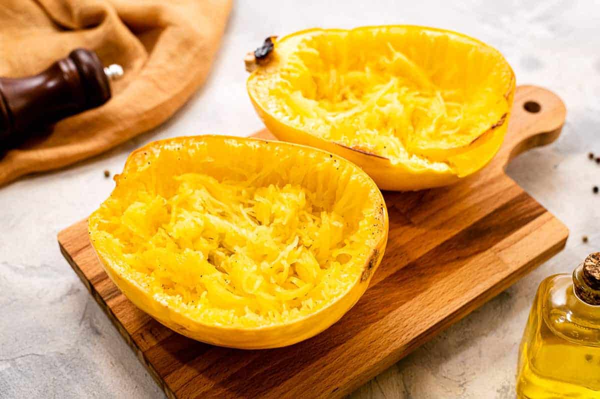 Two halves of spaghetti squash face up that are roasted