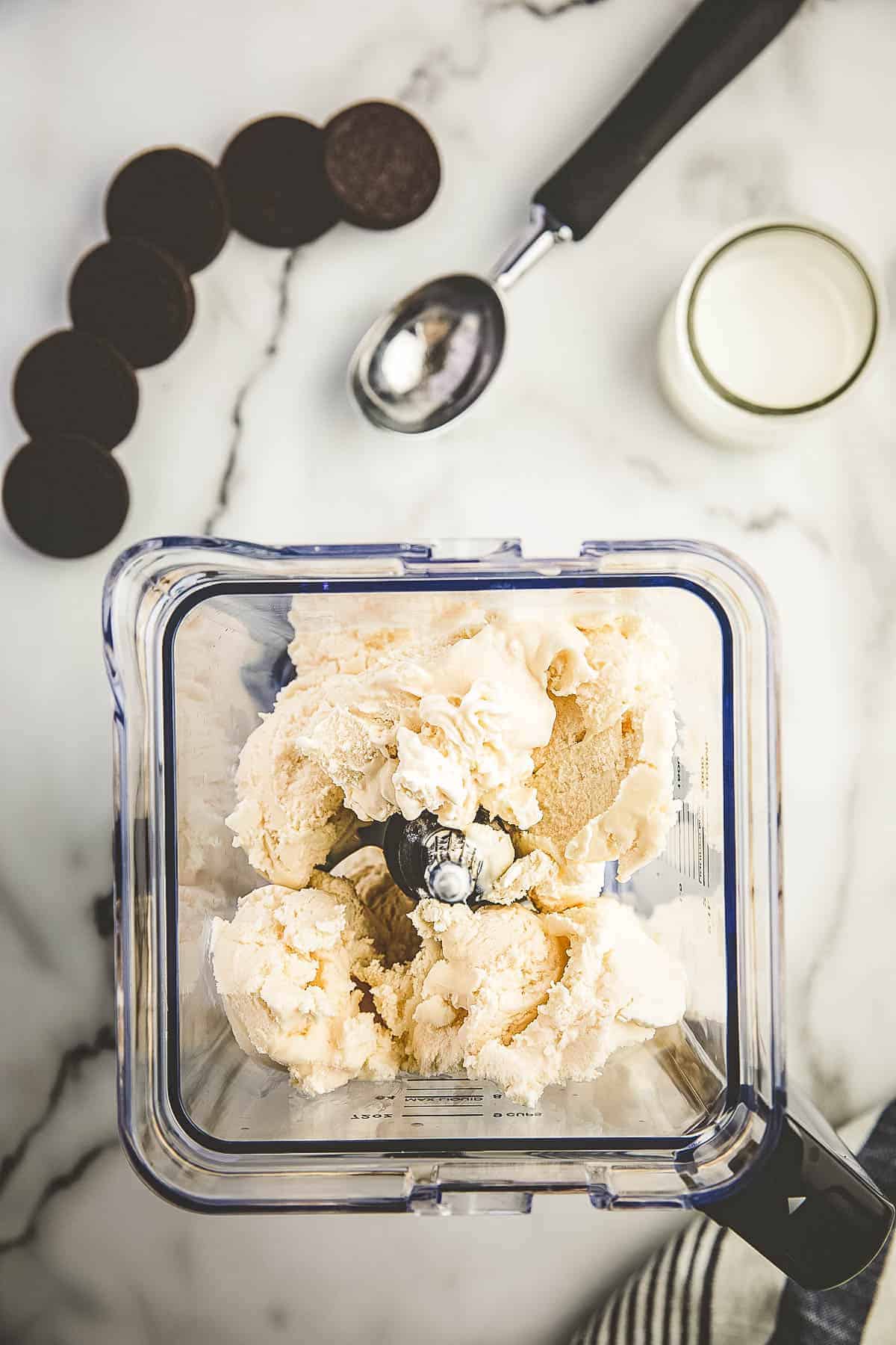 Blender with scoops of vanilla ice cream