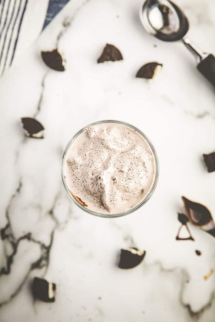 Overhead view of Oreo milkshake in old fashioned tall glass