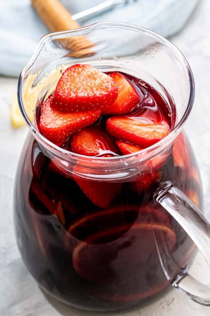 Pitcher of Sangria with sliced strawberries