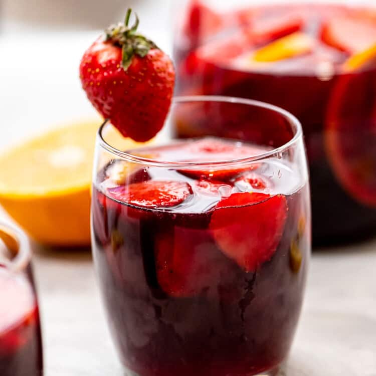 Glass of Red Sangria garnished with a strawberry