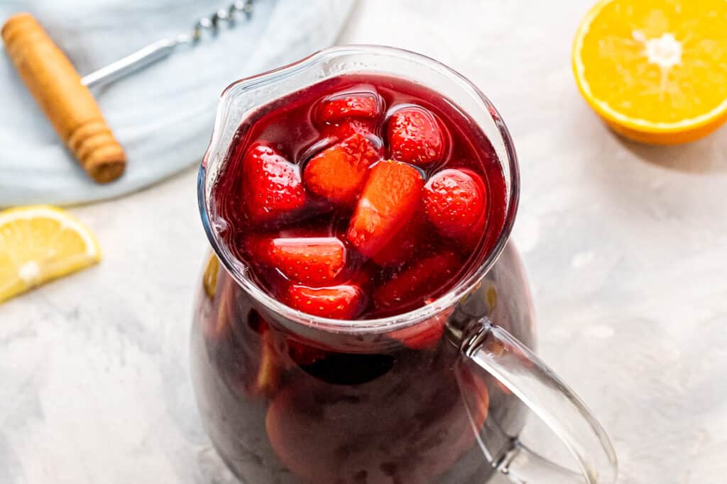 Overhead image of pitcher of sangria with strawberries