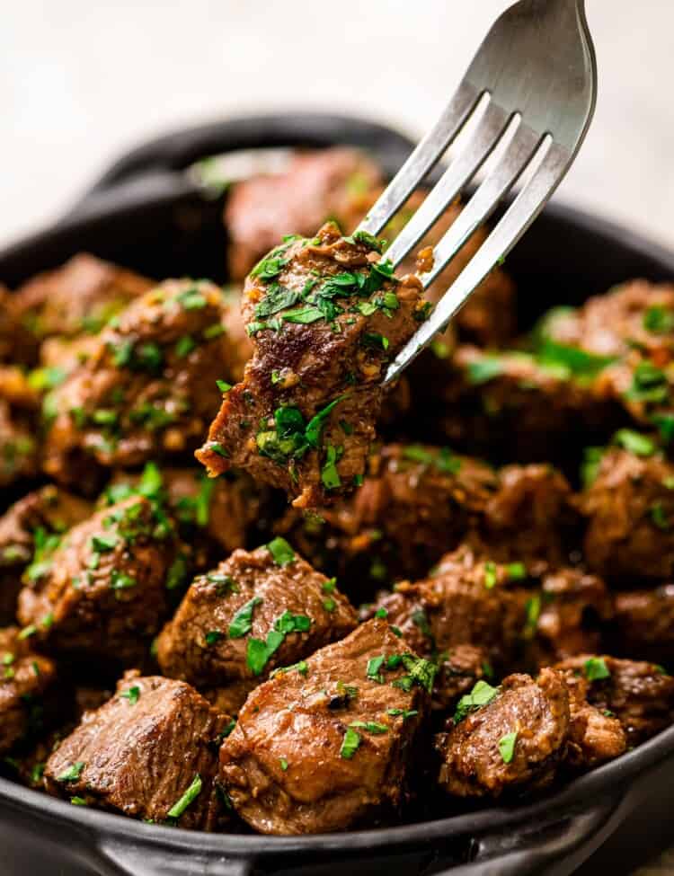 Fork with a steak bite on it
