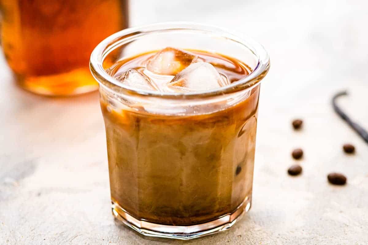 Glass of iced coffee with creamer