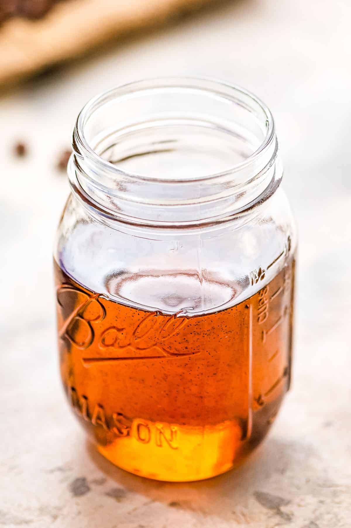 Mason jar with vanilla syrup in it