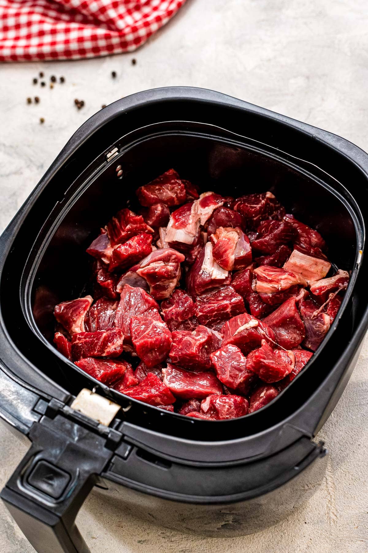 Steak Pieces in Air Fryer Basket