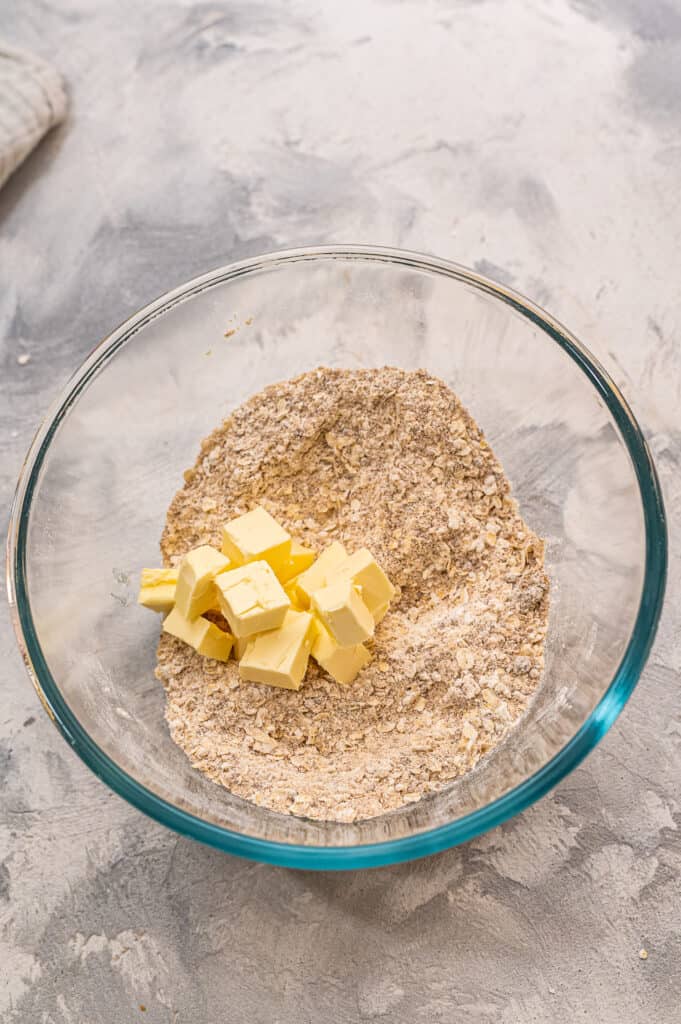 Glass bowl with cubed butter for shortbread crust