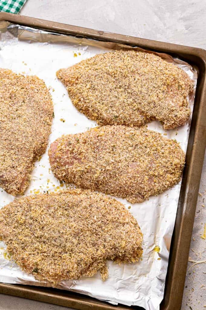 Sheet pan with breaded chicken breasts