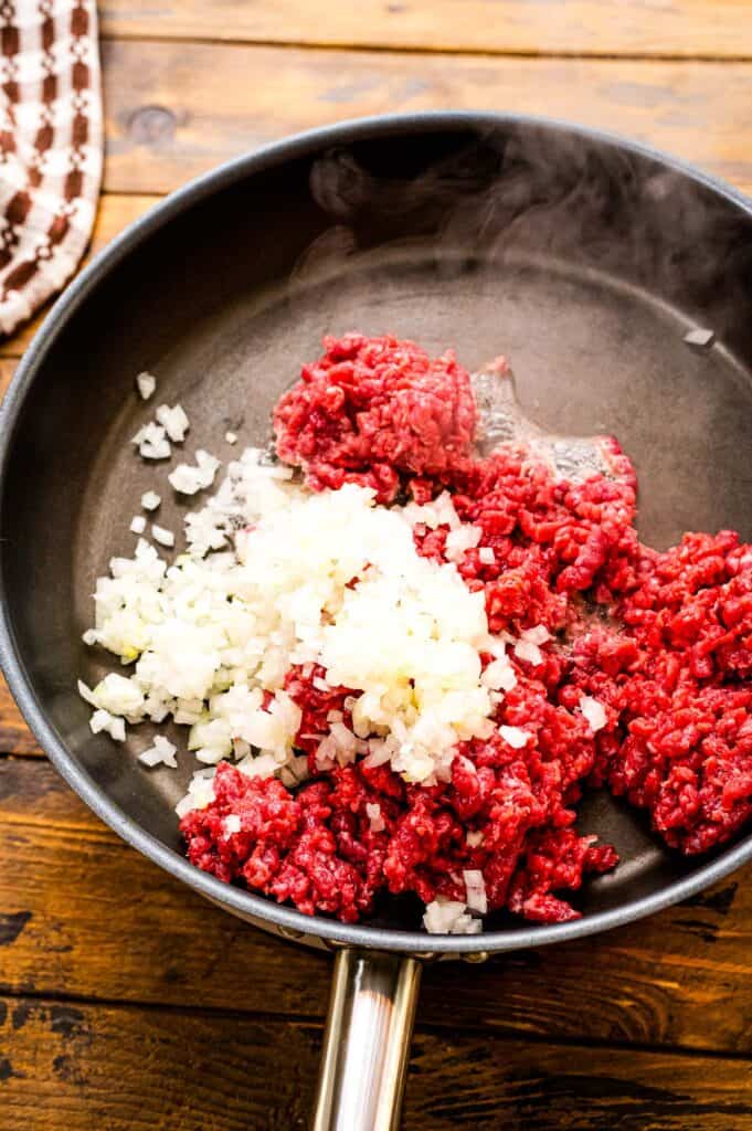 Skillet browning hamburger and onions