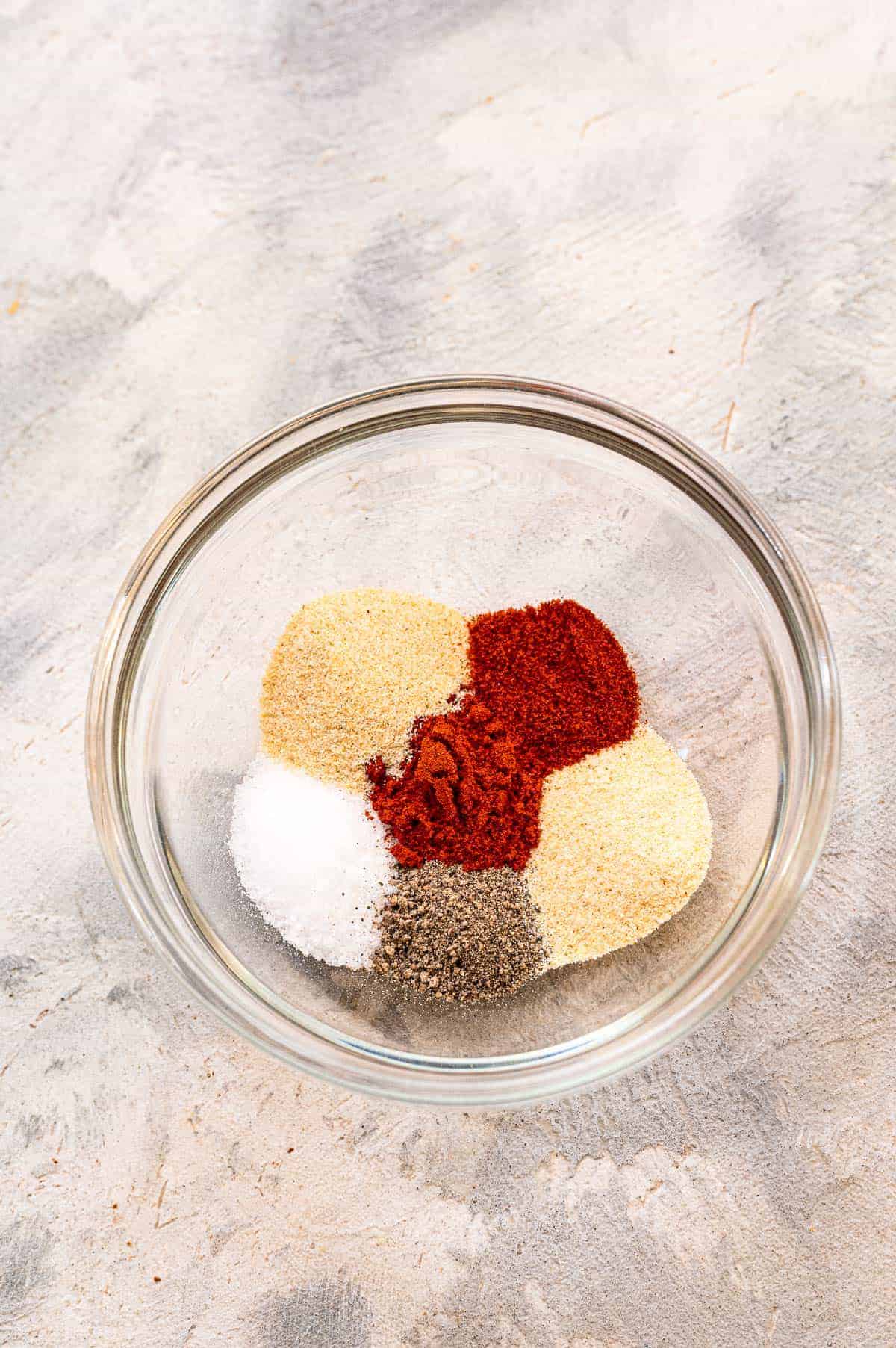 Glass bowl with seasonings before mixing