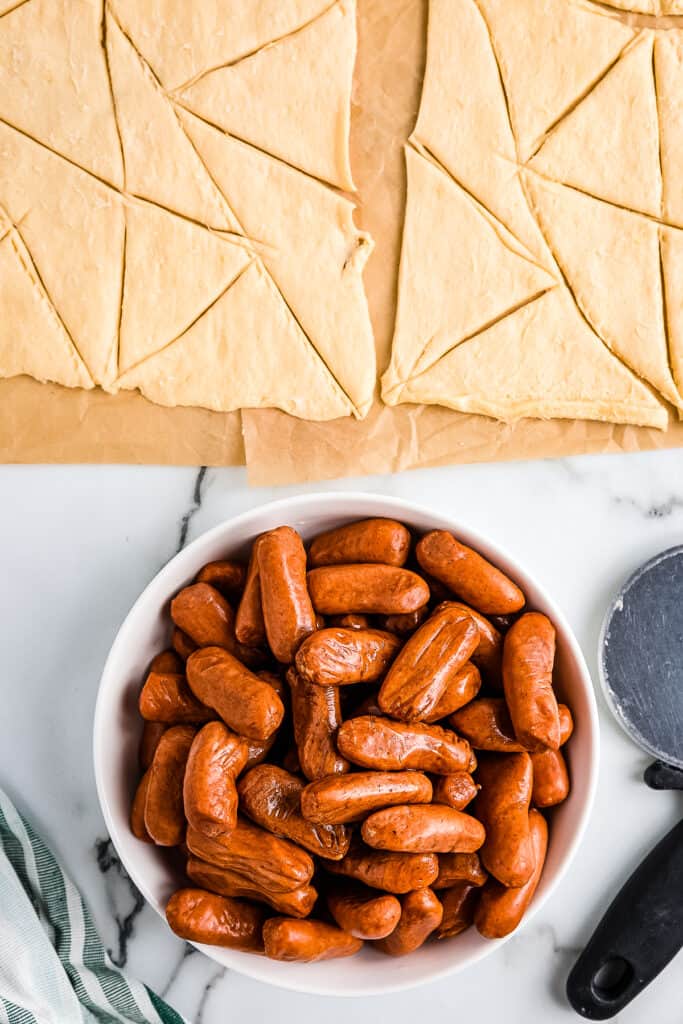 Overhead image of mini cocktail weiners and crescent rolls