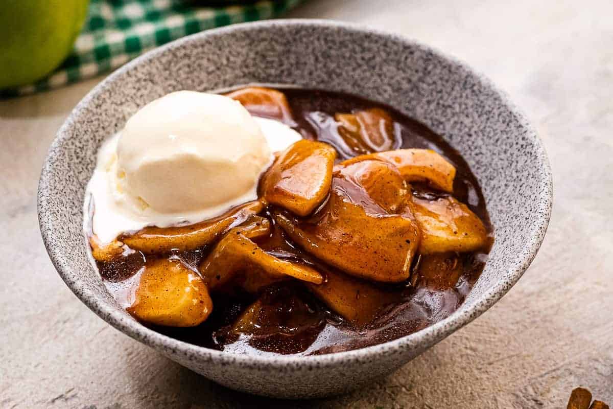 Bowl of cinnamon apples with ice cream