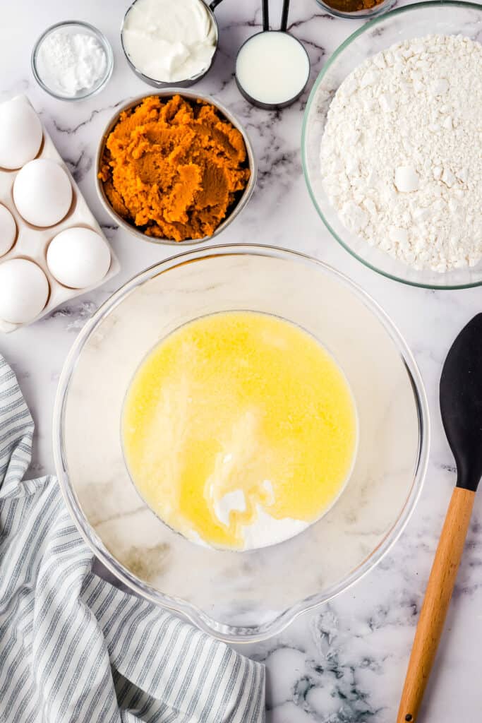 Eggs and sugar in glass bowl for cake